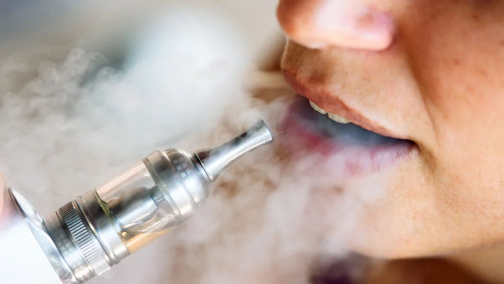 Woman smoking a vape