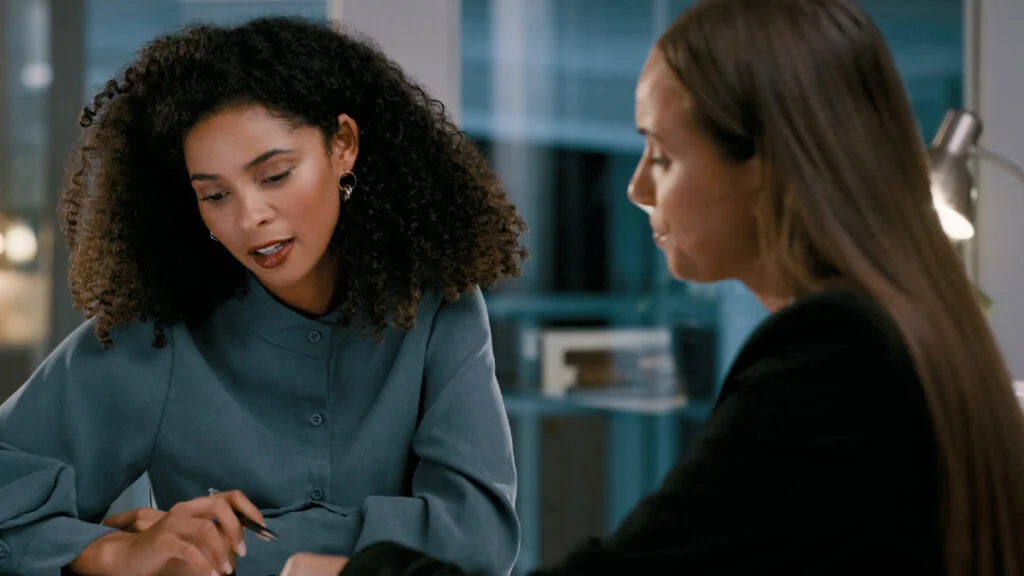 Woman receiving feedback at work